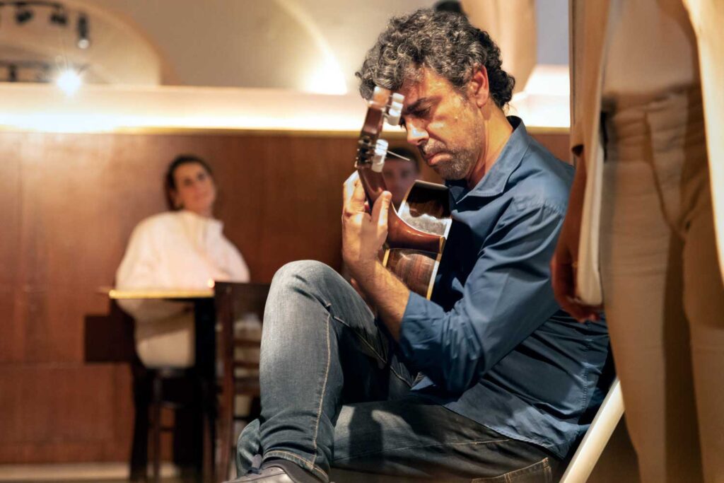 fado musician playing guitar in Lisbon, Portugal