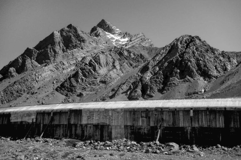 a black and photograph taken at the border crossing in the Andes mountains between Chile and Argentina