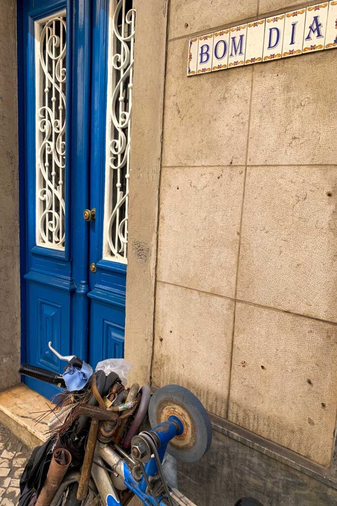 photograph of bom dia tile with blue door in Portugal