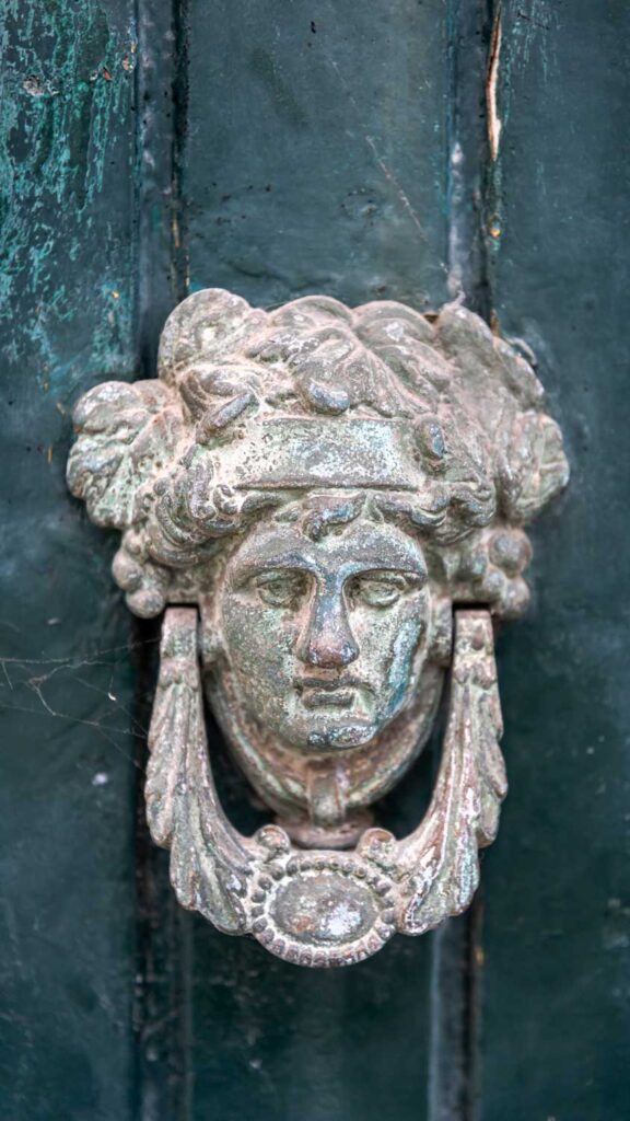 a photo of a batentes or door knocker head in Portugal