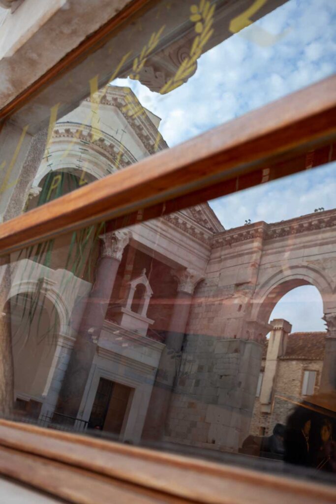 photograph of Diocletian's Palace in Split Croatia in a restaurant window reflection